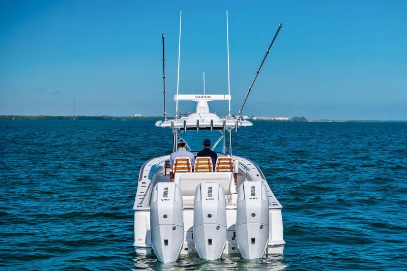 Slide: The Image of 2026 Valhalla Boatworks V-37 on open water, rear view with triple engines. - 61