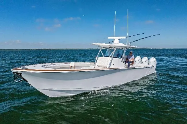 Slide: The Image of 2026 Valhalla Boatworks V-37 cruising on open water under clear blue skies. - 72