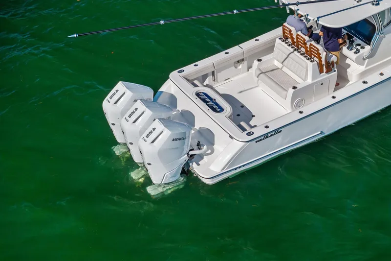 Slide: The Image of 2026 Valhalla Boatworks V-37 with triple Mercury outboard engines on green water. - 73