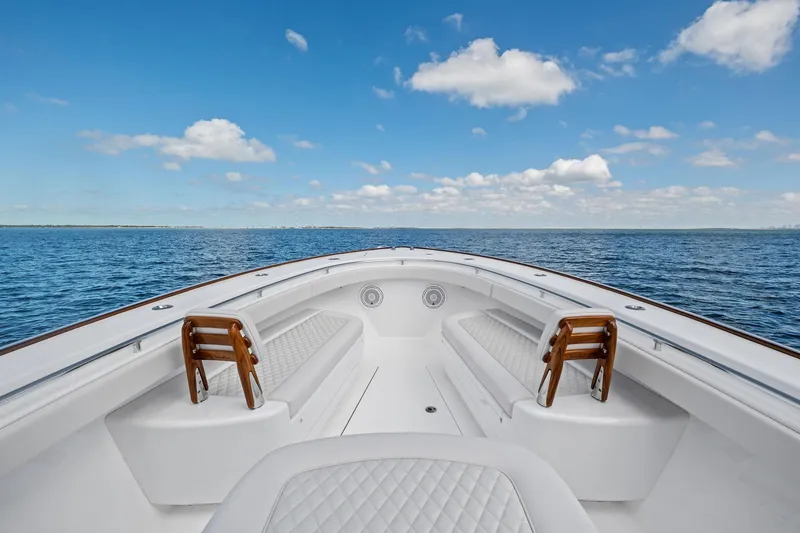 Slide: The Image of 2026 Valhalla Boatworks V-37 on open water, showcasing spacious seating and clear skies. - 8