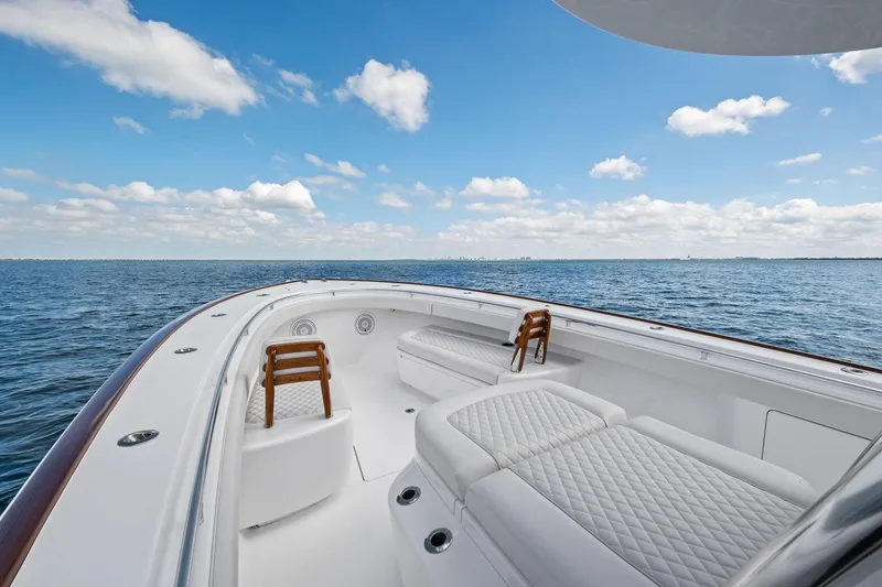 Slide: The Image of 2026 Valhalla Boatworks V-37 on open water, featuring luxurious seating and clear skies. - 9