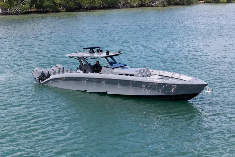 Slide: The Image of 2023 Midnight Express 43 Solstice boat cruising on calm blue waters. - 10