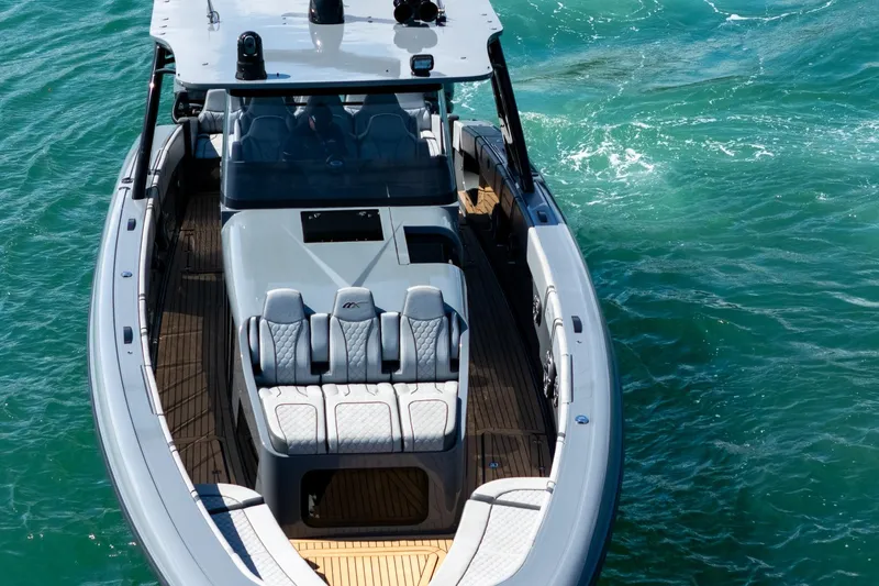 Slide: The Image of 2023 Midnight Express 43 Solstice luxury boat on clear blue water. - 16