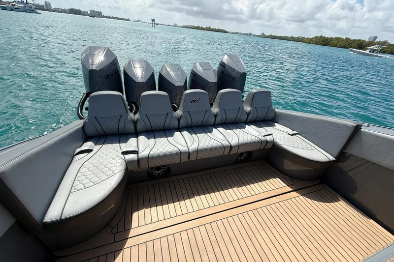Slide: The Image of 2023 Midnight Express 43 Solstice boat with luxurious seating and powerful engines on open water. - 17