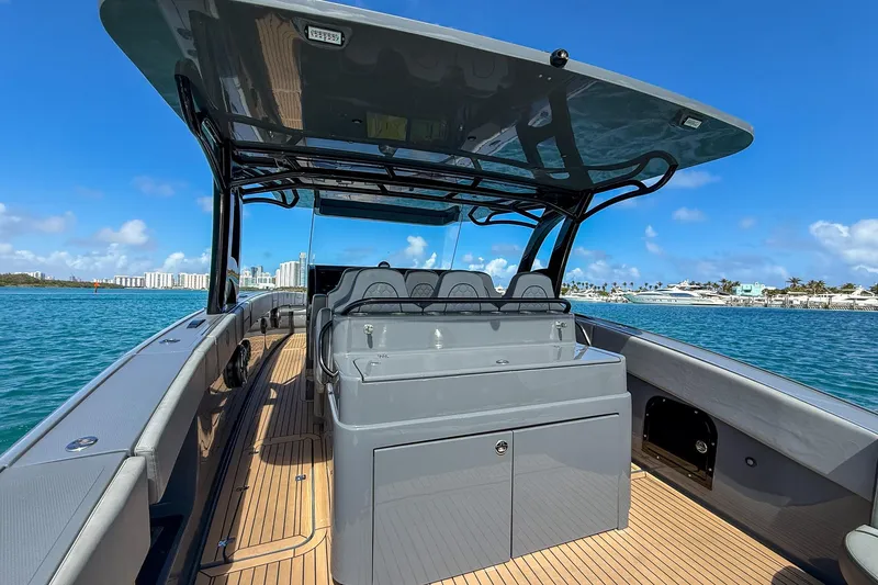 Slide: The Image of 2023 Midnight Express 43 Solstice boat on water, featuring sleek design and spacious deck. - 18