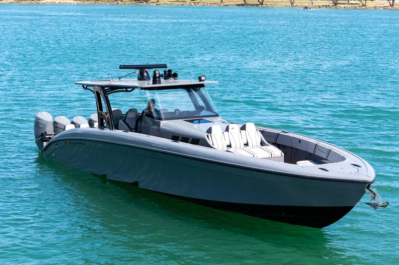 Slide: The Image of 2023 Midnight Express 43 Solstice boat on clear blue water. - 2