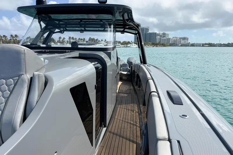 Slide: The Image of 2023 Midnight Express 43 Solstice luxury boat on calm waters, showcasing sleek design and modern features. - 25