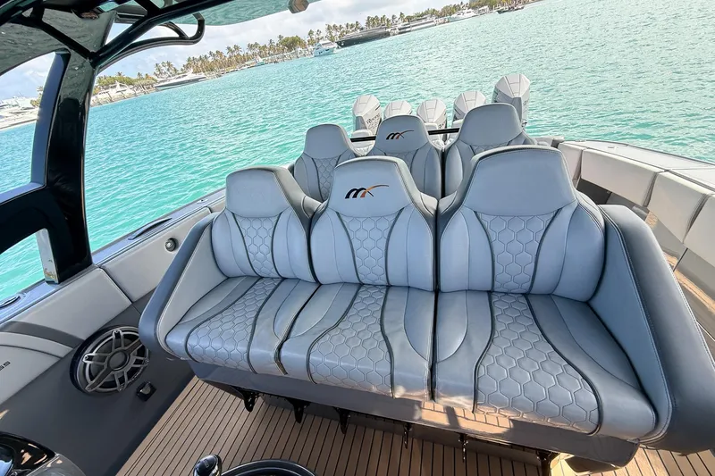 Slide: The Image of Luxurious seating on 2023 Midnight Express 43 Solstice boat with scenic ocean view. - 29