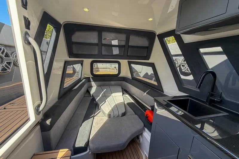 Slide: The Image of Luxurious interior of 2023 Midnight Express 43 Solstice boat with seating and kitchenette. - 32