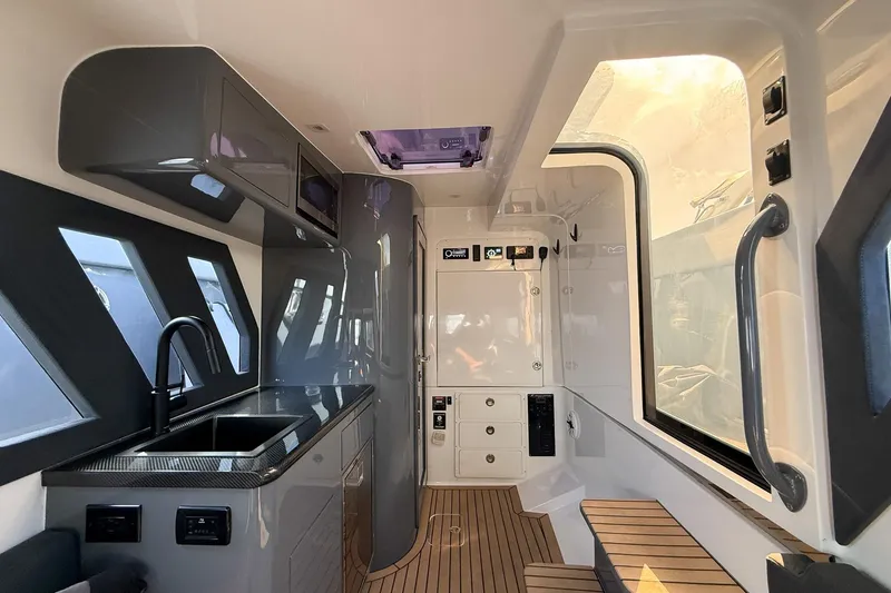 Slide: The Image of Interior of 2023 Midnight Express 43 Solstice boat with modern design and amenities. - 34