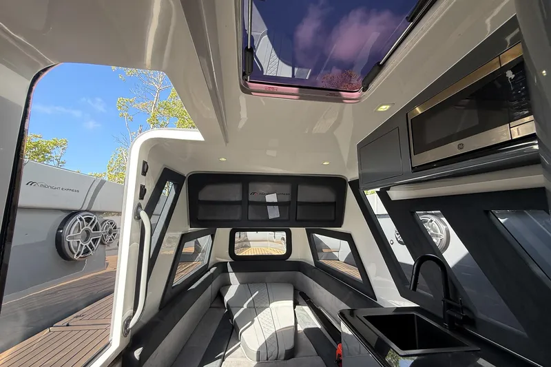 Slide: The Image of Interior of 2023 Midnight Express 43 Solstice boat with modern amenities and sleek design. - 38