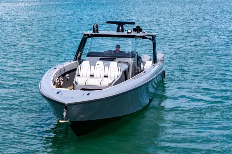 Slide: The Image of 2023 Midnight Express 43 Solstice boat on clear blue water. - 4