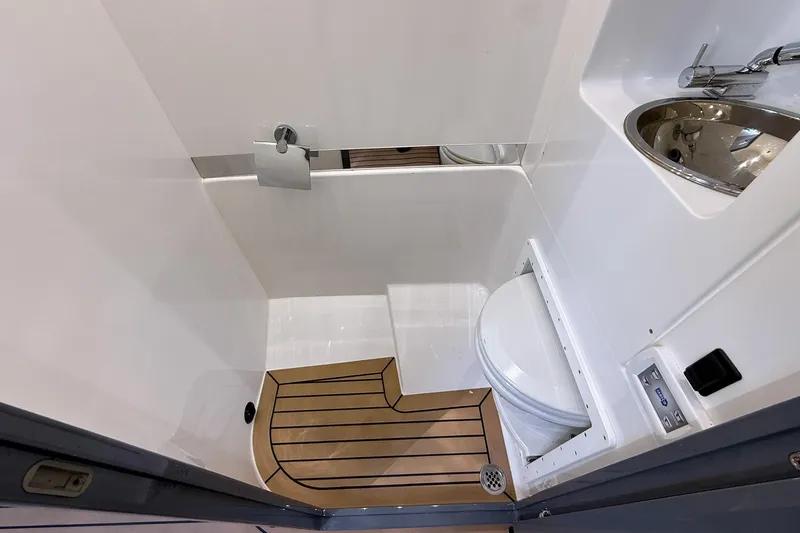 Slide: The Image of 2023 Midnight Express 43 Solstice boat bathroom with modern fixtures and wooden flooring. - 40
