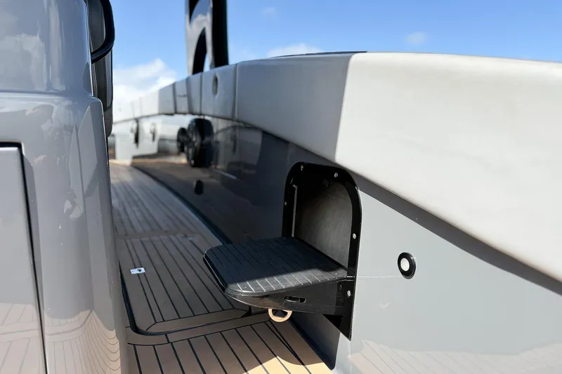 Slide: The Image of 2023 Midnight Express 43 Solstice yacht deck with retractable step feature. - 49