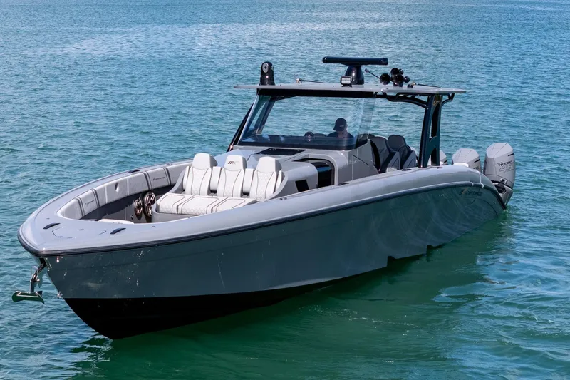 Slide: The Image of 2023 Midnight Express 43 Solstice boat on clear blue water. - 5