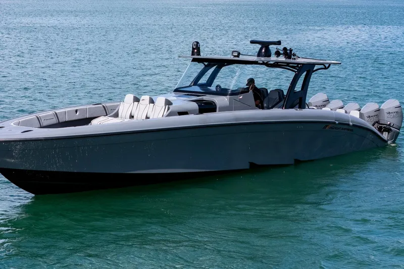 Slide: The Image of 2023 Midnight Express 43 Solstice luxury boat on clear blue water. - 6
