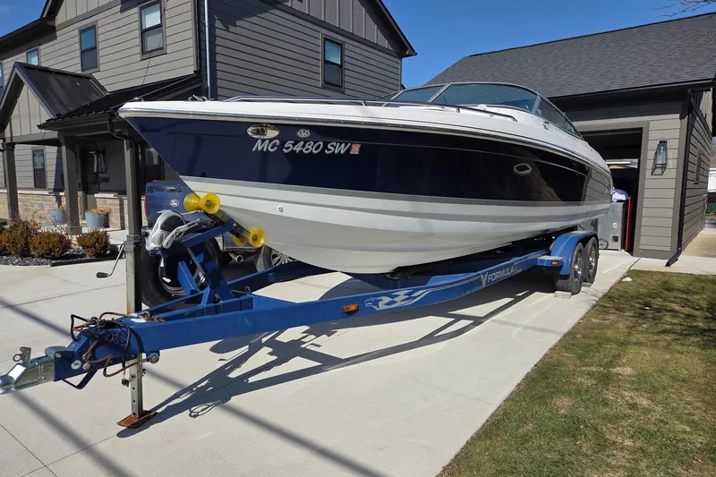 The Image of 2005 Formula 260 Sun Sport boat on trailer in residential driveway. - 0