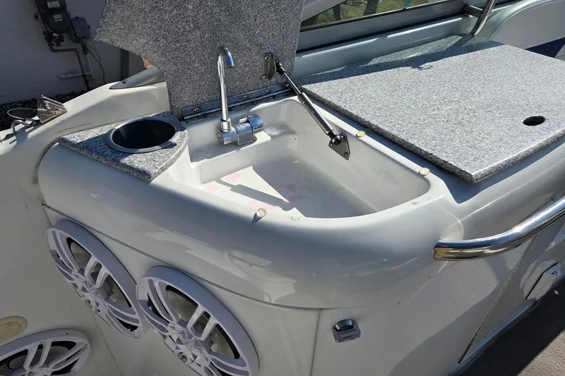 Slide: The Image of 2005 Formula 260 Sun Sport boat sink with faucet and speakers. - 13