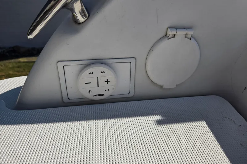 Slide: The Image of Control panel on a 2005 Formula 260 Sun Sport boat, featuring Fusion audio controls. - 16