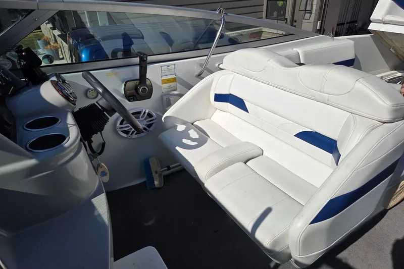 Slide: The Image of Interior of a 2005 Formula 260 Sun Sport boat with white and blue seating. - 20