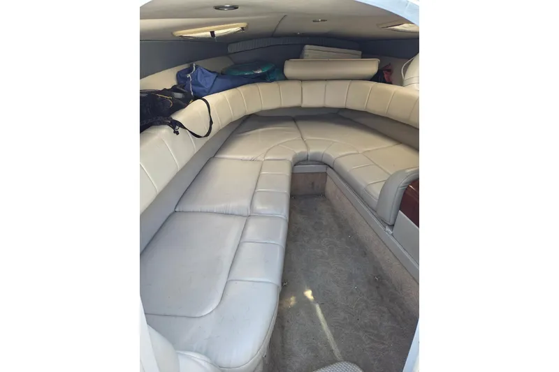 Slide: The Image of Interior of 2005 Formula 260 Sun Sport boat with cushioned seating and storage. - 23