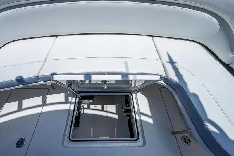 Slide: The Image of 2019 Mag Bay 33 CC boat with open storage compartment on deck. - 14