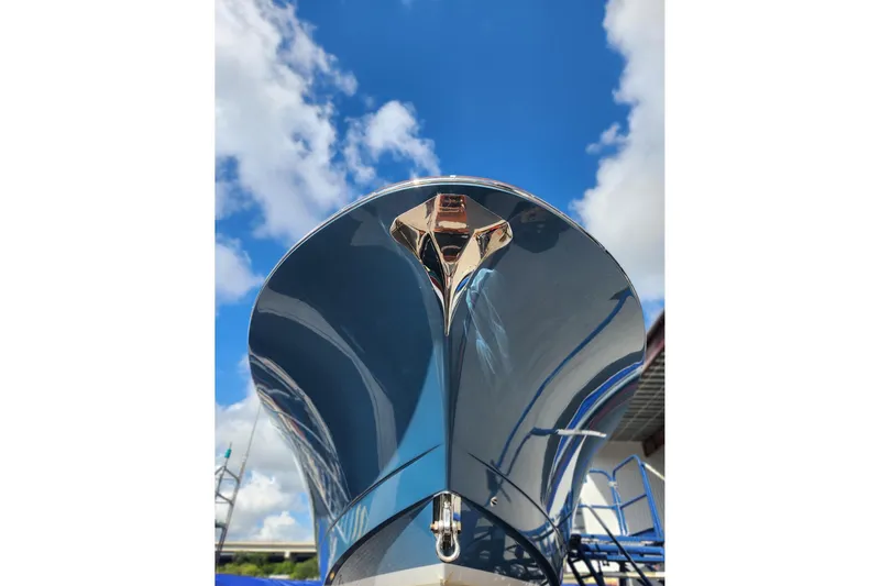 Slide: The Image of 2019 Mag Bay 33 CC boat hull against a bright blue sky. - 6