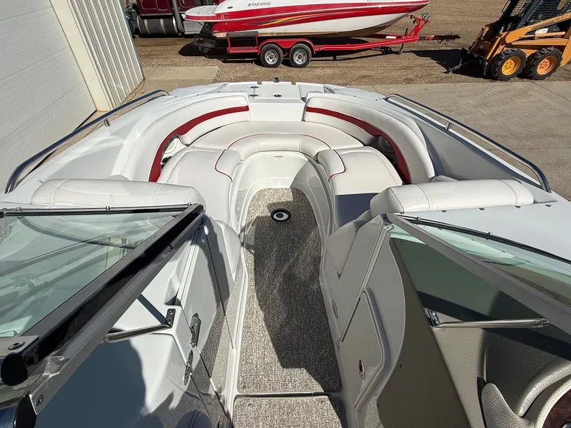 Slide: The Image of Interior view of a 2012 Crownline 252 EX boat with white seating. - 11