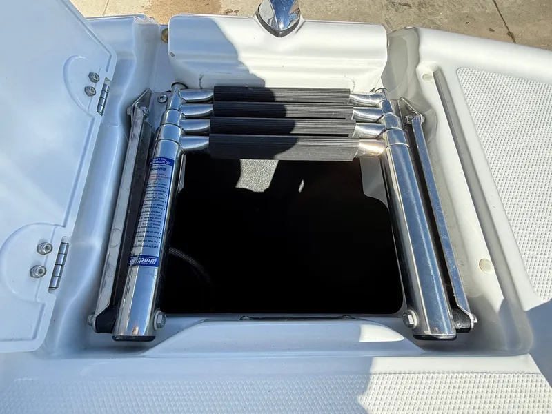 Slide: The Image of Folded swim ladder on a 2012 Crownline 252 EX boat. - 12