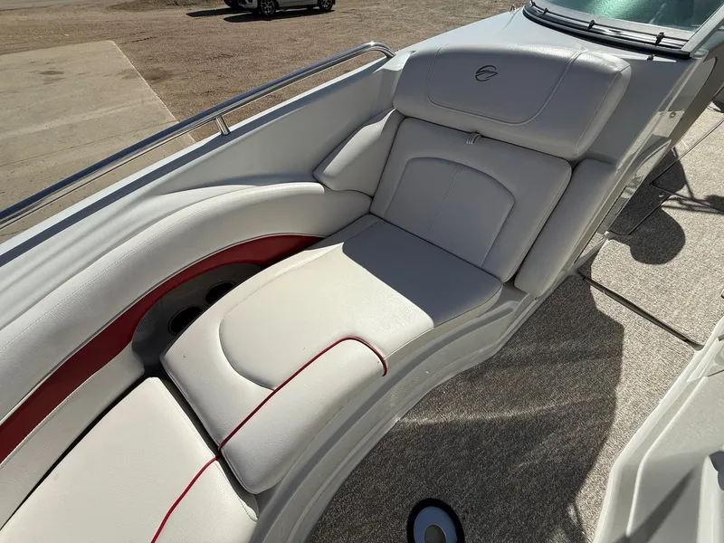 Slide: The Image of Interior of a 2012 Crownline 252 EX boat with beige upholstery. - 13