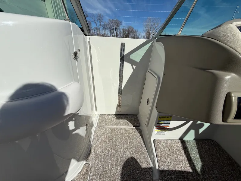 Slide: The Image of Interior of a 2012 Crownline 252 EX boat in sunlight. - 17