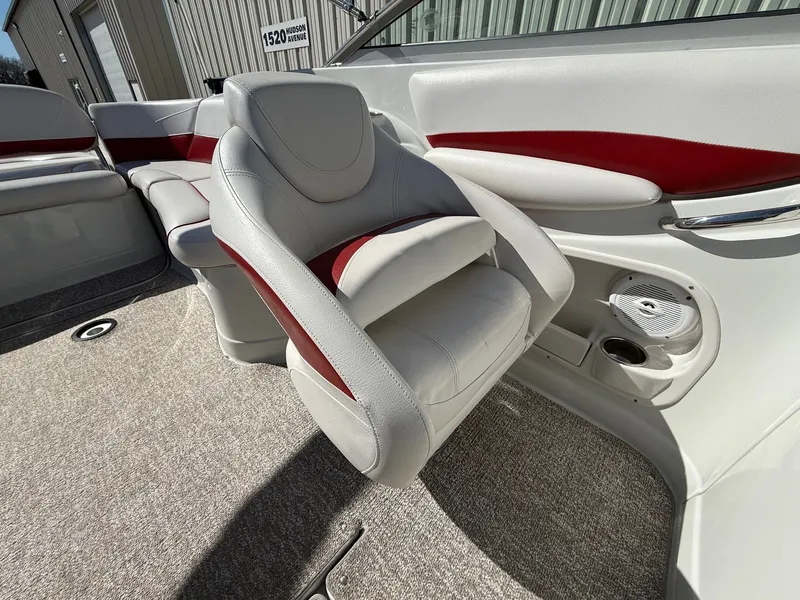 Slide: The Image of Interior of a 2012 Crownline 252 EX boat with white and red seating. - 20