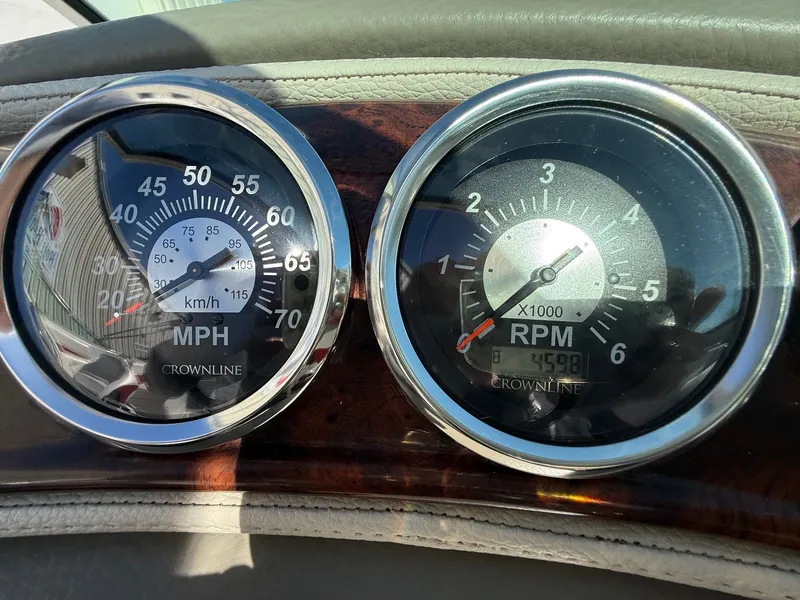 Slide: The Image of Dashboard of a 2012 Crownline 252 EX with speedometer and tachometer. - 23