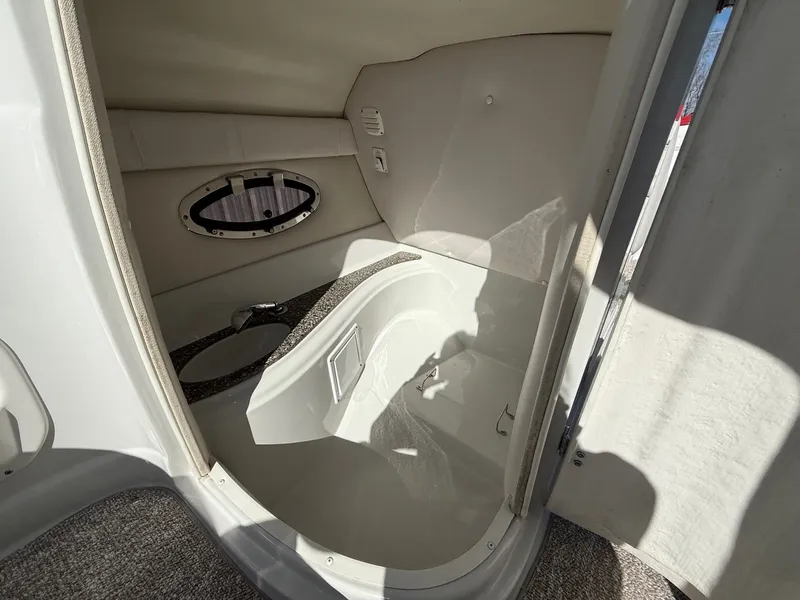Slide: The Image of Interior of 2012 Crownline 252 EX with window and seating area. - 27