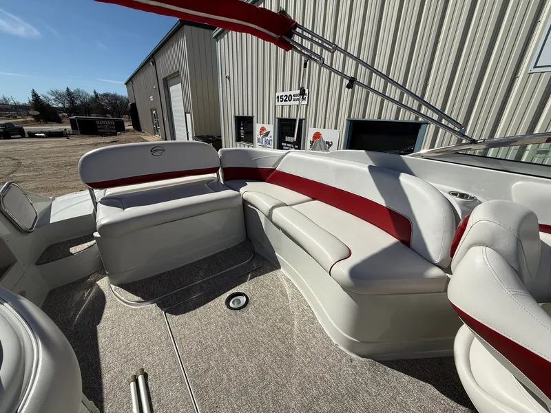 Slide: The Image of Interior of a 2012 Crownline 252 EX boat with red accents. - 28