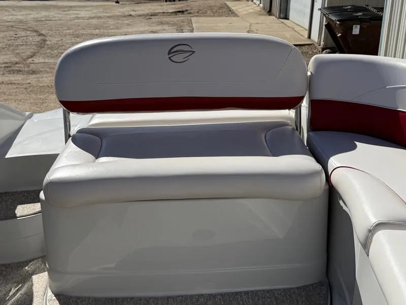 Slide: The Image of Seating area of a 2012 Crownline 252 EX boat with red accent. - 33
