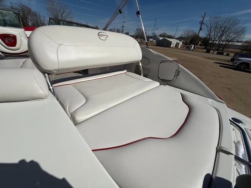 Slide: The Image of 2012 Crownline 252 EX boat with white cushioned seating. - 34