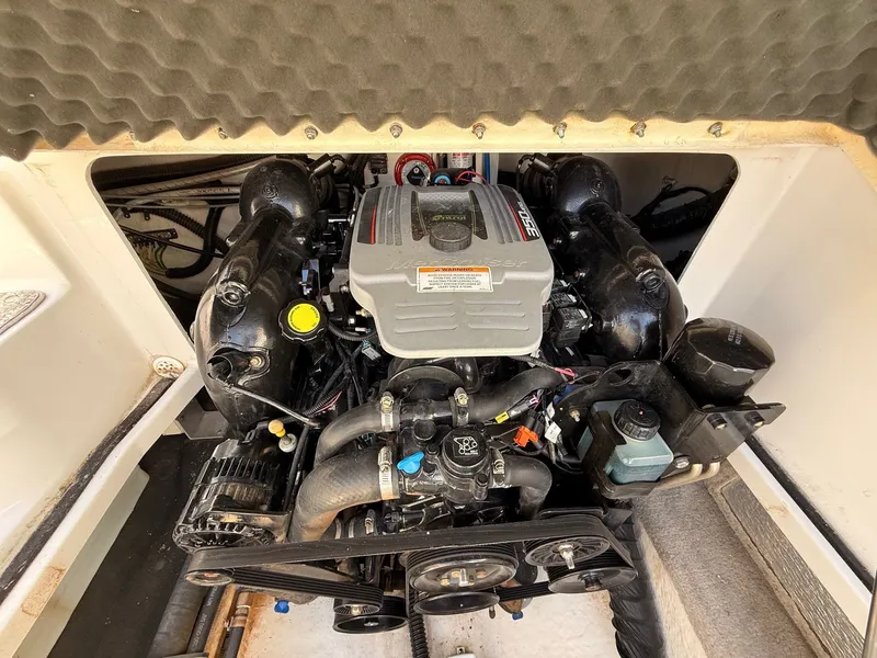 Slide: The Image of Engine compartment of a 2012 Crownline 252 EX boat. - 38