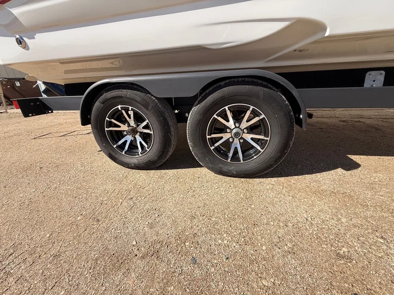 Slide: The Image of 2012 Crownline 252 EX boat trailer with dual wheels. - 40