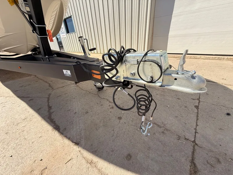 Slide: The Image of Trailer hitch of a 2012 Crownline 252 EX boat on concrete ground. - 41