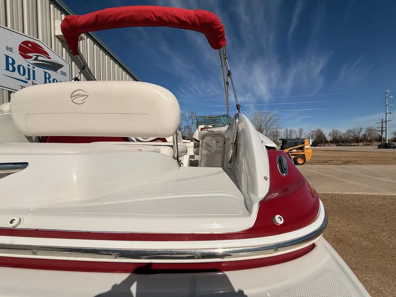 Slide: The Image of 2012 Crownline 252 EX boat with red and white interior. - 9