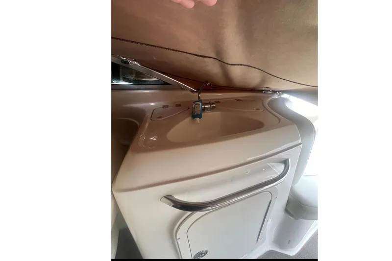 Slide: The Image of Interior of a 2004 Chaparral 260 SSi featuring a sink. - 10