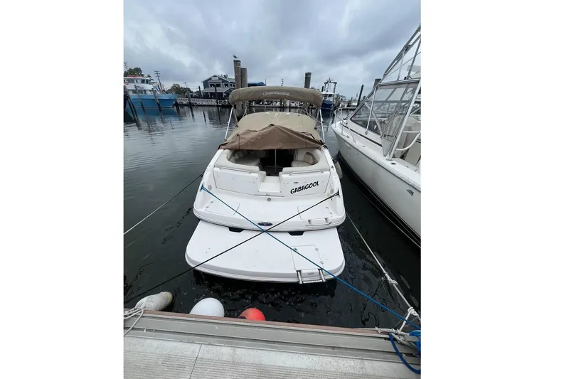 Slide: The Image of 2004 Chaparral 260 SSi boat docked at harbor. - 2