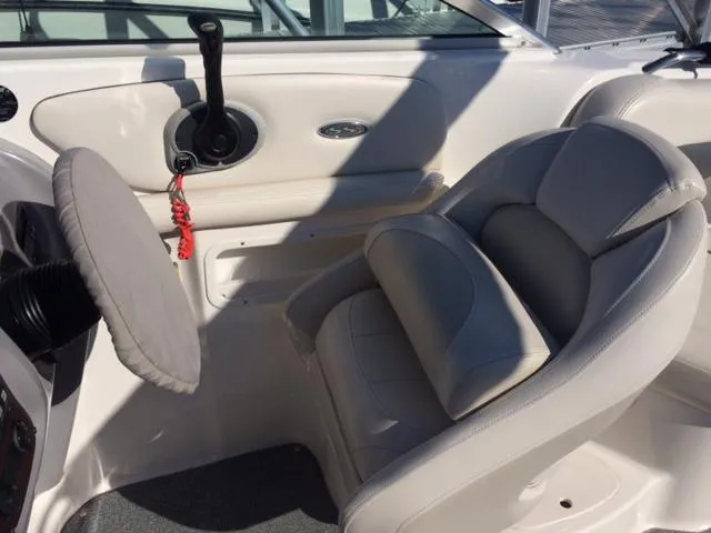 Slide: The Image of Interior of a 2004 Chaparral 260 SSi boat with steering and seat. - 3