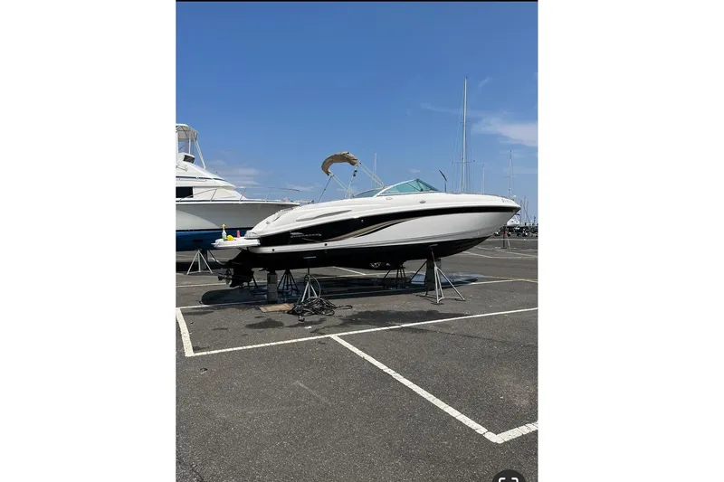 Slide: The Image of 2004 Chaparral 260 SSi boat on a parking lot. - 4