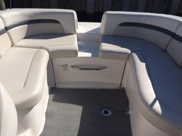 Slide: The Image of Interior of a 2004 Chaparral 260 SSi boat with beige seating. - 6
