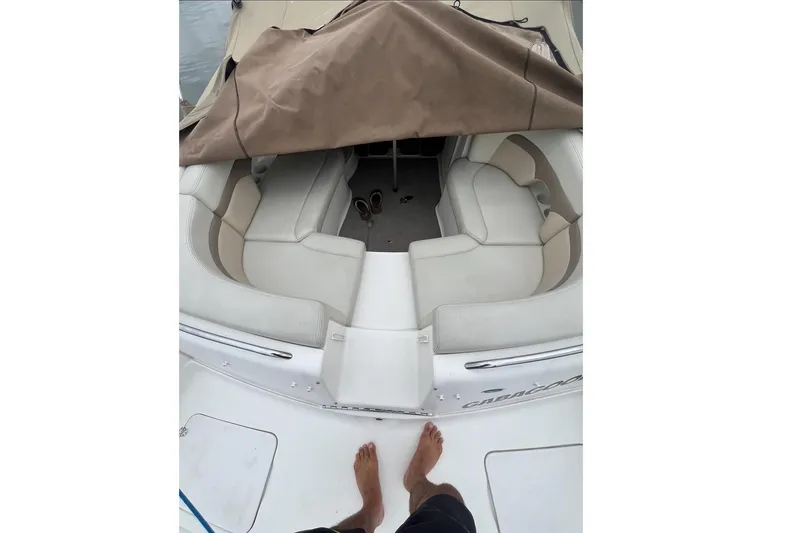Slide: The Image of Interior of a 2004 Chaparral 260 SSi boat with beige cover. - 8