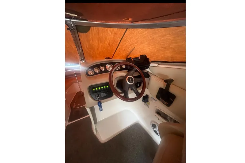 Slide: The Image of Interior view of a 2004 Chaparral 260 SSi boat cockpit. - 9