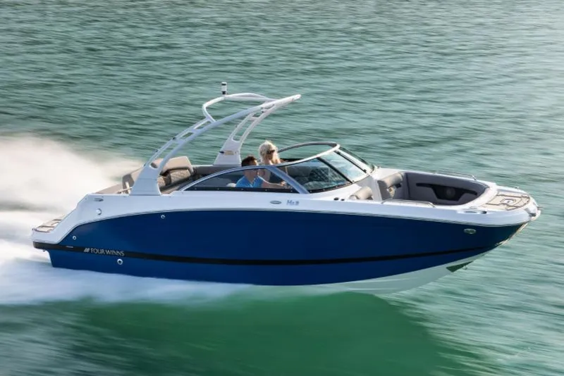Slide: The Image of Manufacturer Provided Image: 2025 Four Winns HD3 boat cruising on clear water, showcasing sleek design and performance. - 18