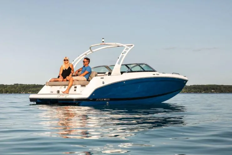 Slide: The Image of Manufacturer Provided Image: 2025 Four Winns HD3 boat on calm water with two people relaxing onboard. - 20